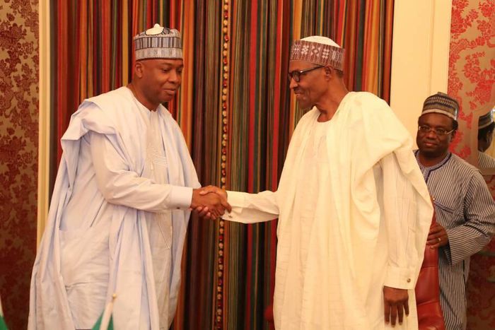 Senate President, Bukola Saraki, shakes hands with President Muhammadu Buhari