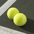 ___8940168___2018___10___5___9___two-tennis-balls-on-tennis-court-elevated-view-royalty-free-image-200443252-001-1538667208