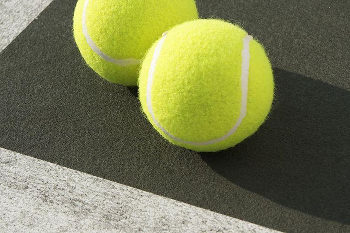 ___8940168___2018___10___5___9___two-tennis-balls-on-tennis-court-elevated-view-royalty-free-image-200443252-001-1538667208