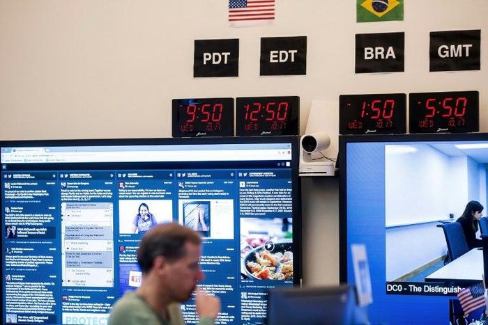 Employees work in Facebook's "War Room," during a media demonstration on October 17, 2018, in Menlo Park, California. The freshly launched unit at Facebook's Menlo Park HQ is the nerve center for the fight against misinformation and manipulation of the...