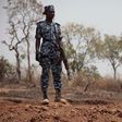 Security officers stand guard where German archaeologists were kidnapped in Janjala village, Nigeria, in February 2017. Kidnappers ransomed their captives for $200,000 and killed two villagers during the kidnapping.