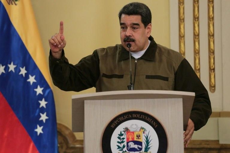 Colombian President Ivan Duque says the leftist president of neighboring Venezuela, Nicolas Maduro (pictured), is "clinging to power"
