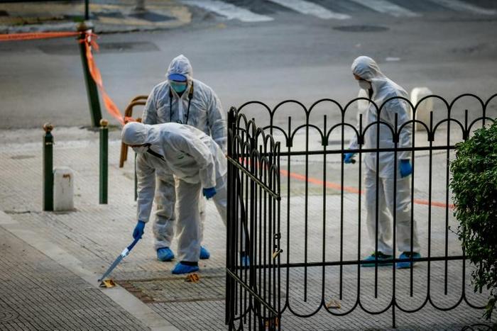 A homemade bomb outside a Greek Orthodox church in central Athens injured a police officer and the site's caretaker, but there were no immediate claims of responsibility