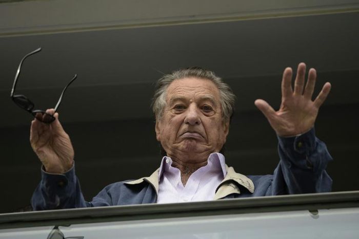 A file picture of Franco Macri, father of Argentina's President Mauricio Macri, waving from a box at the Bombonera football stadium during a football match in Buenos Aires on April 24, 2016