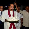 The crisis was sparked by the president sacking the prime minister and naming former strongman leader Mahinda Rajapakse (C) in his place