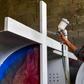 An inmate of La Joya prison in Panama works on painting a cross that will be used during Pope Francis's visit to Panama for World Youth Day celebrations in January