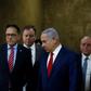 Israeli Prime Minister Benjamin Netanyahu (2nd-R) arrives for the weekly cabinet meeting at the Prime Minister's office in Jerusalem on December 23, 2018