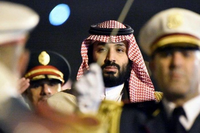 Saudi Crown Prince Mohammed bin Salman is seen behind a military band upon his arrival at Algiers International Airport, southeast of the capital Algiers on December 2, 2018