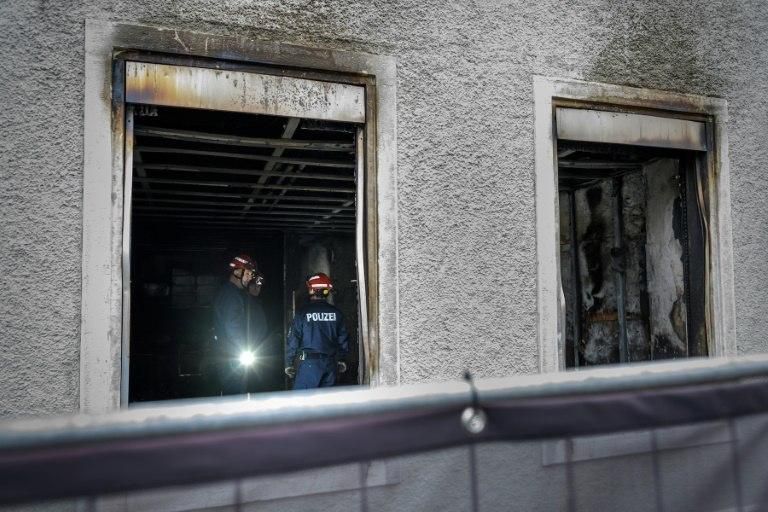 The building was intact from the outside but all of the apartments were blackened by smoke and fire, an AFP photographer said