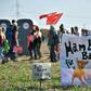 A banner reads "Hambi for Bambi" as thousands of demonstrators gather to celebrate the suspension of the planned razing of the forest in what they dubbed the region's "biggest-ever anti-coal rally"