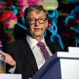 Microsoft founder Bill Gates talks next to a container with human feces, a stunt to draw attention to the lack of toilets in developing countries around the world