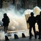 Clouds of tear gas fill the street during a "yellow vest" demonstration in the western French city of Nantes