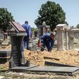 Gravediggers in Johannesburg, where between 45 and 60 graves are re-opened each week on average to allow for second burials