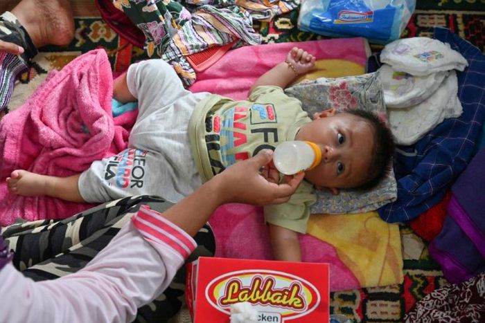 Aid workers have reported children are sick with fevers following the tsunami in Indonesia