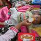 Aid workers have reported children are sick with fevers following the tsunami in Indonesia
