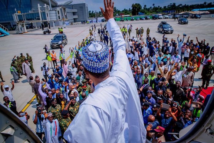 President Muhammadu Buhari waves at a crowd of supporters in Port Harcourt, Rivers State on October 25, 2018