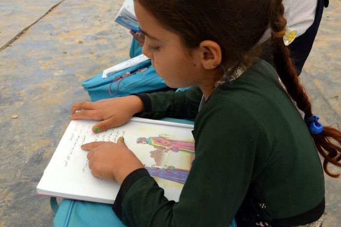 A makeshift primary school in the dusty Hammam al-Alil 2 camp in Iraq's north opened earlier this year