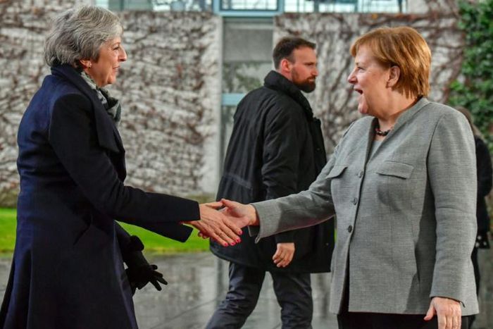 British Prime Minister Theresa May (left) meets German Chancellor Angela Merkel in Berlin as she tries to muster EU help in getting her Brexit deal through a hostile Parliament in London