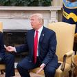 Outgoing White House Chief of Staff John Kelly, pictured with President Donald Trump in July 2017, told the Los Angeles Times that many migrants have been misled by traffickers