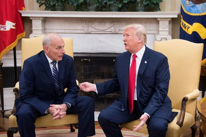 Outgoing White House Chief of Staff John Kelly, pictured with President Donald Trump in July 2017, told the Los Angeles Times that many migrants have been misled by traffickers