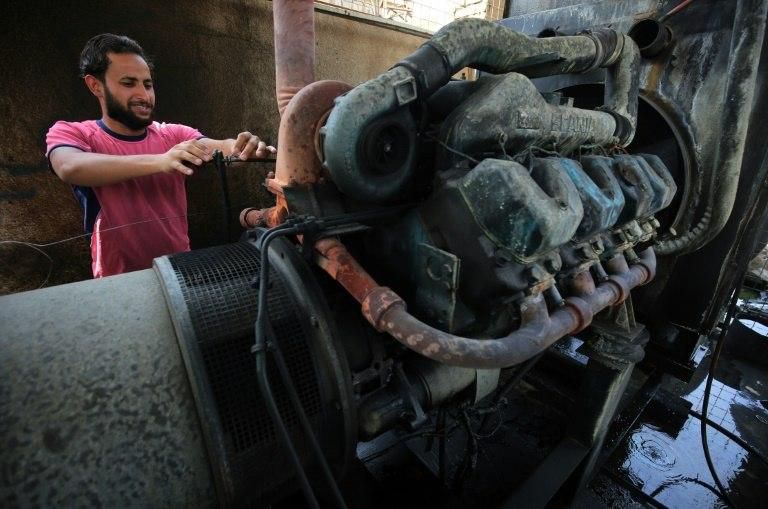 A man in Baghdad checks a electricity generator in this file photo taken on September 13, 2017