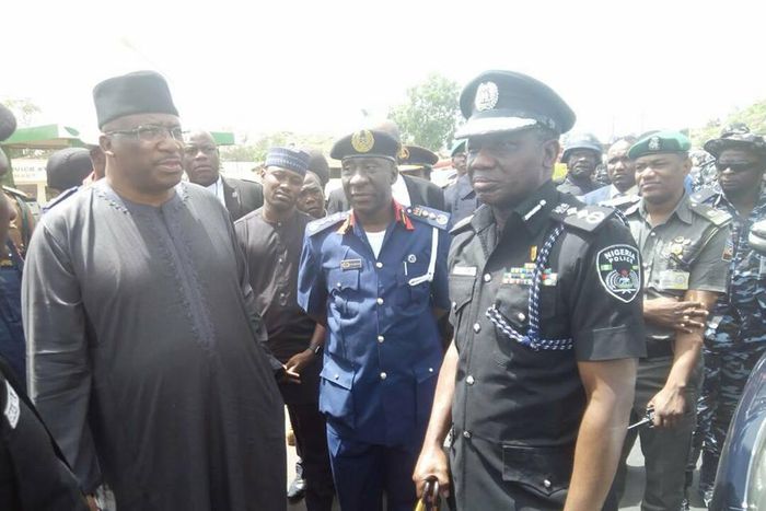 The Inspector-General of Police, Ibrahim Idris (right), Commandant-General of Nigeria Security and Civil Defence Corps (NSCDC), Mohammed Gana (middle) and Minister of Interior, Abdulrahman Dambazau (left)