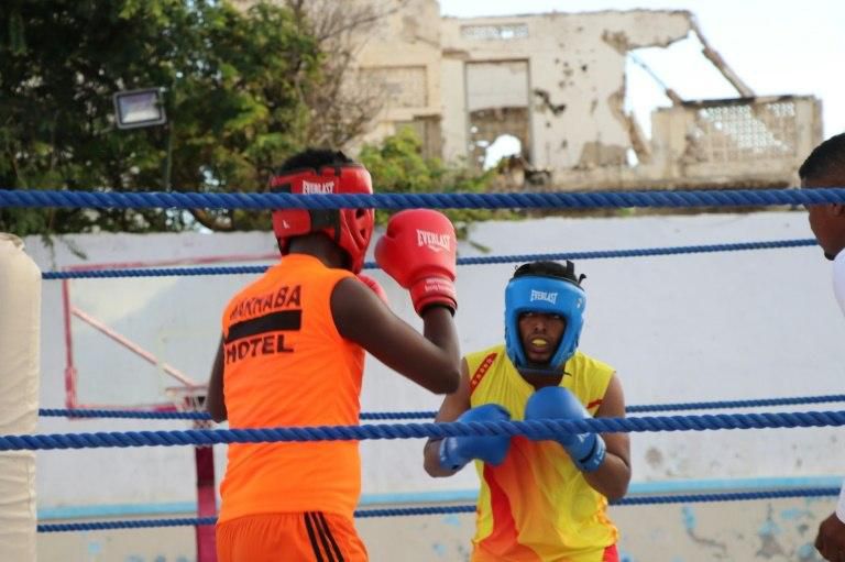 Athletes squared off in a ring set up on a basketball court surrounded by ruined buildings that bore witness to the country's long conflict