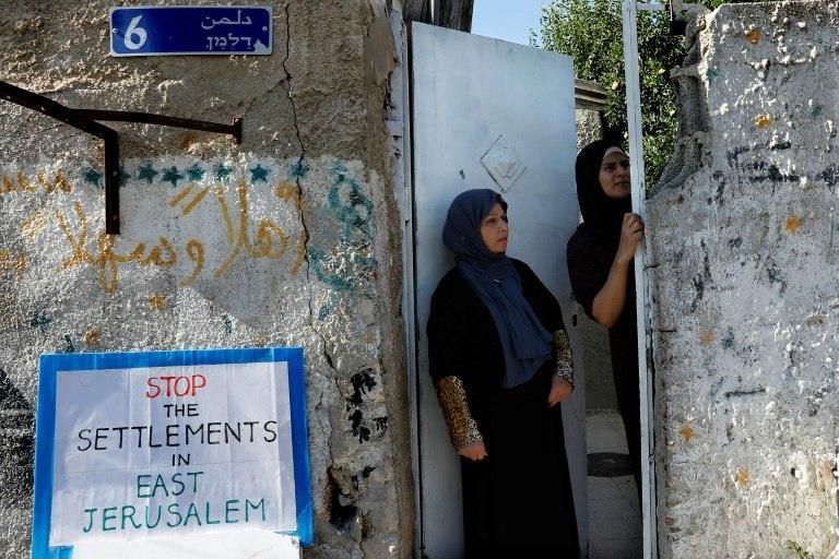 Palestinians look towards a protest against the eviction of Palestinian families from their homes in the east Jerusalem neighbourhood of Sheikh Jarrah on August 4, 2017