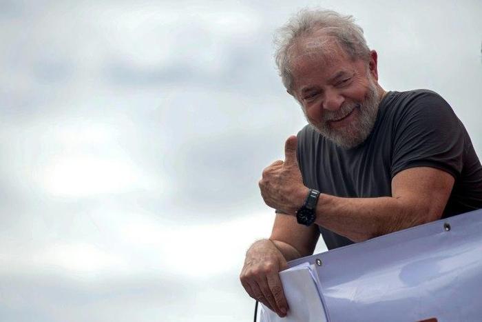 Former Brazilian president Luiz Inacio Lula da Silva gives the thumbs-up to supporters at a rally in Itaborai, Rio de Janeiro state, in December 2017
