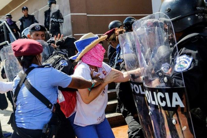 Police arrest a demonstrator in the Nicaraguan capital Managua