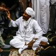 Sadiq al-Mahdi, Sudan's ex-prime minister and leader of the opposition Umma Party, is greeted by supporters in a mosque in the capital Khartoum's twin city of Omdurman on December 19, 2018 after his return from exile