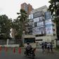 The Monaco building, once home to Colombian drug lord Pablo Escobar, is seen covered with pictures of victims of his Medellin Cartel, in Medellin, Colombia, on December 11, 2018
