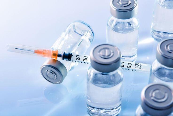 ___9080480___2018___11___7___14___vials-and-syringe-on-blue-table-top-elevated-royalty-free-image-867398442-1541534573