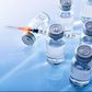 ___9080480___2018___11___7___14___vials-and-syringe-on-blue-table-top-elevated-royalty-free-image-867398442-1541534573