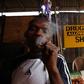 An unidentified man smokes weed at the New Afrikan Shrine in Lagos