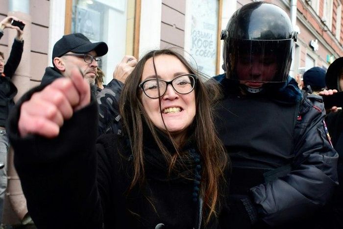 Police arrest a protester in Saint Petersburg on Sunday
