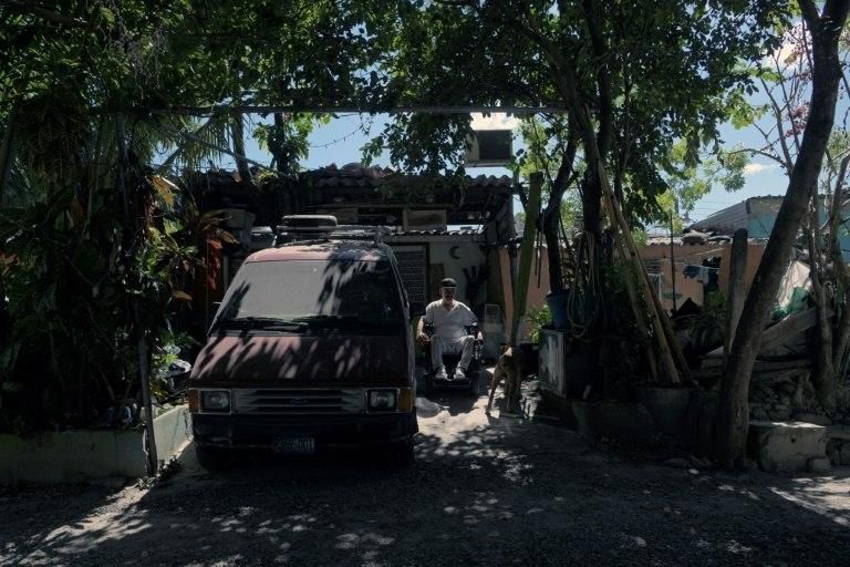 Wheelchair-bound Jose Martin Alas, 55, is happy that his three daughters are living in the United States where "they're safe" from El Salvador's gang violence