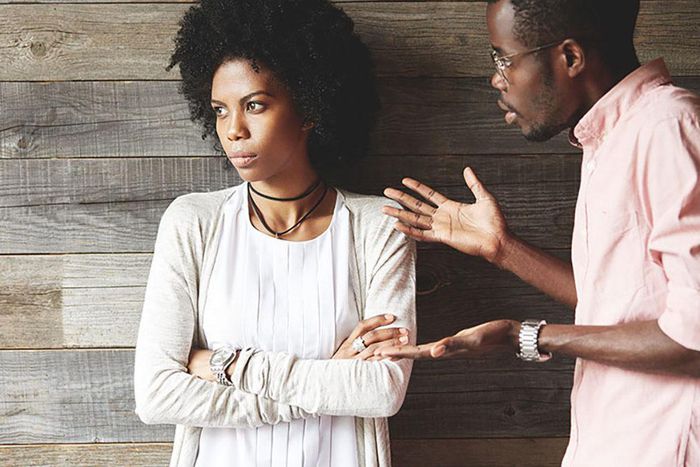 Man angrily speaking with woman [Credit: Getty]