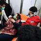 A Syrian woman receives treatment at a hospital after an assault on Aleppo, which Russia claimed was a chemical attack by rebels