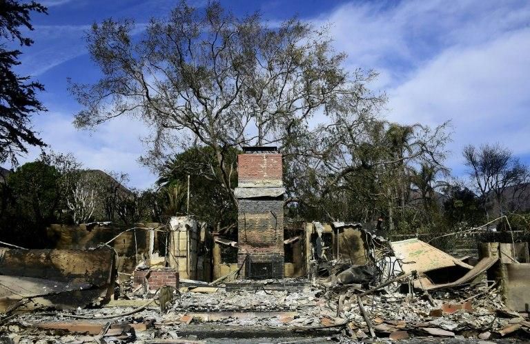A chimney is all that remains of a house in Malibu, California, after the "Woolsey Fire"