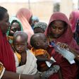 Women wait with their children under a shed for food rations at an internally displaced persons (IDP) camp on the outskirts of Maiduguri, northeast Nigeria June 6, 2017.