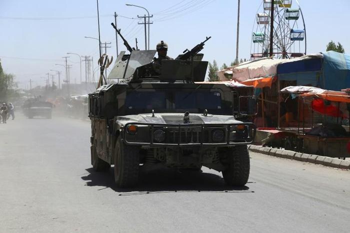 Afghan forces patrol in Ghazni in August 2018 following days of intense fighting against Taliban militants. US peace envoy Zalmay Khalilzad has raised doubts about the Taliban's desire to end the 17-year war
