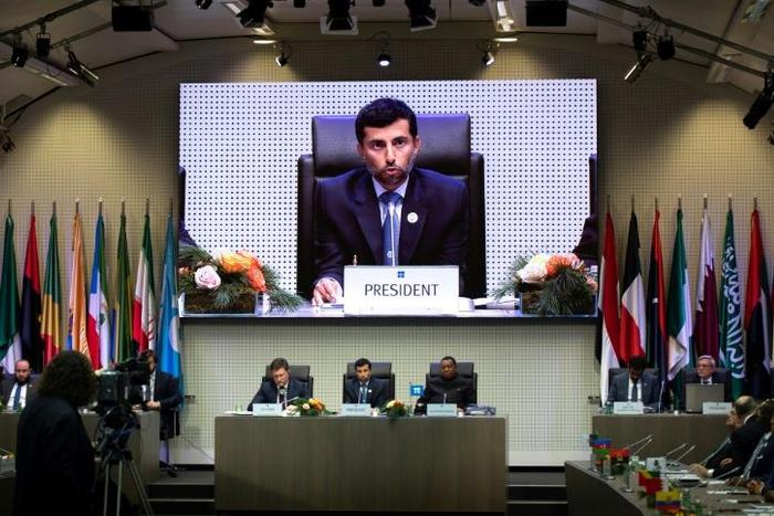 UAE Energy Minister Suhail al-Mazrouei, seen here addressing the December 7 meeting at which OPEC and some non-OPEC producers agreed to cut oil output, says they will meet again in April to review the impact