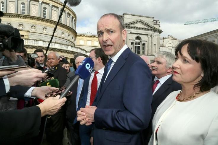 Fianna Fail leader Micheal Martin (C, pictured March 2016) said that his party is "determined that the political chaos we see in London will not be allowed to spread to Ireland"