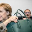German Chancellor Angela Merkel has urged allies not to "snipe away at each other" as regional poll challenges loom -- but analysts say she has reached the "twilight period" of her rule