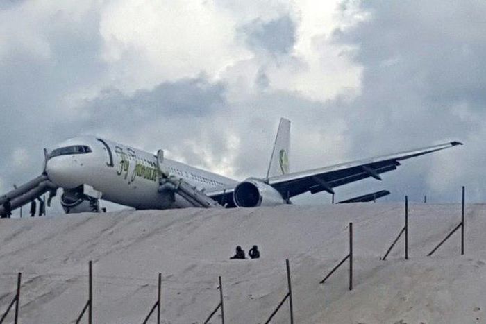 A Toronto-bound Fly Jamaica plane is seen after crash-landing at the Cheddi Jagan International Airport in Georgetown, Guyana on November 9, 2018