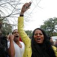 Crowds outside the court house celebrate the guilty verdict in the murder trial of Chicago police officer Jason Van Dyke