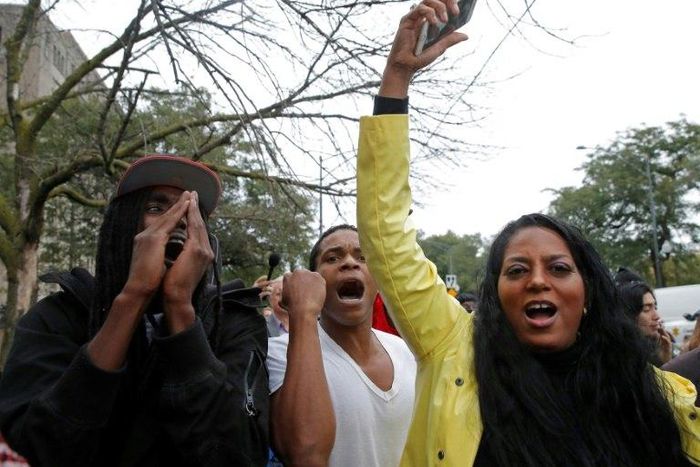 Crowds outside the court house celebrate the guilty verdict in the murder trial of Chicago police officer Jason Van Dyke