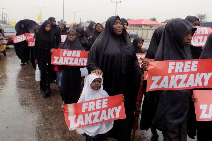 Picture from the Northern Nigerian city of Kano shows protesters from the pro-Iranian Islamic Movement in Nigeria (IMN) marching in the rain through the streets to press for the release of their leader Ibrahim Zakzaky and his wife on November 5, 2016