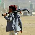 An Yemeni man holds an AK-47 as people gather in the capital Sanaa to show their support to the Shiite Huthi movement against the Saudi-led intervention, on December 19, 2018